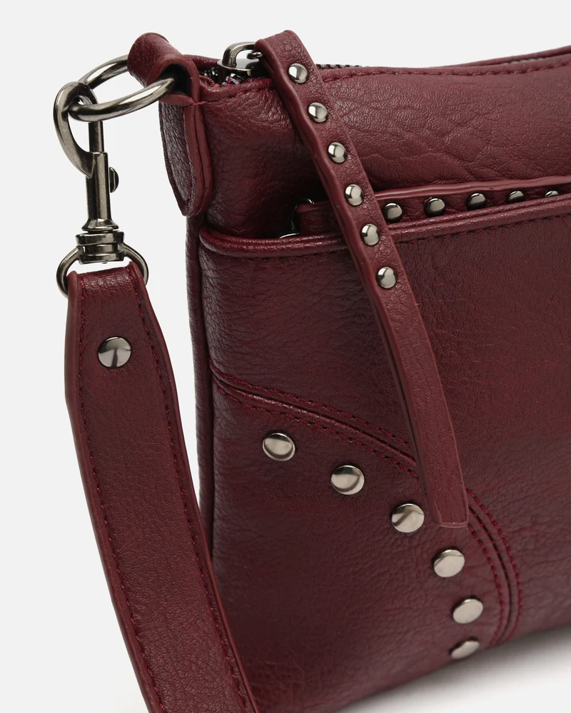 Sereny bolso bandolera pequeño con detalles metálicos